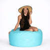 lady posing on a capri blur round outdoor ottoman
